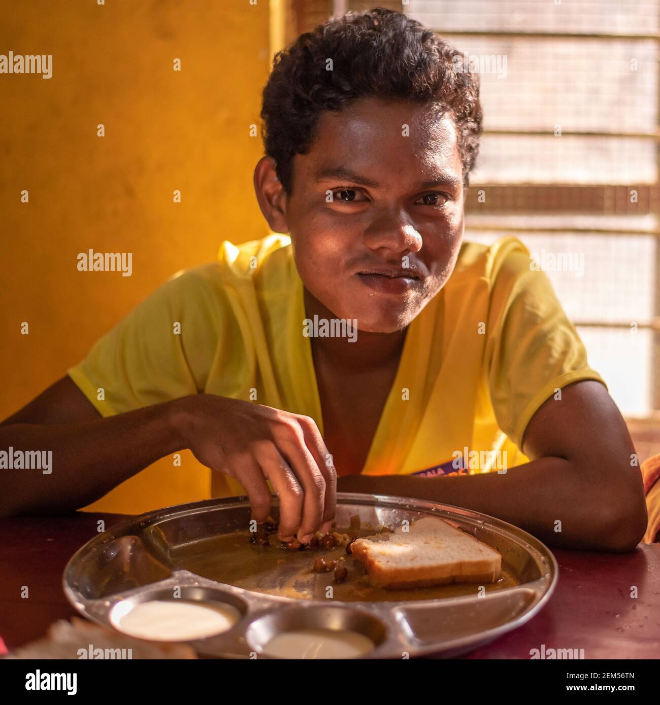 Rajasthan. India. 07-02-2018. Portrait of a male adolescent after finishing his lunch at school. Stock Photo