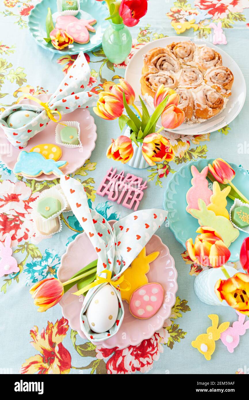 Colorful table setting with sweets for Easter Stock Photo