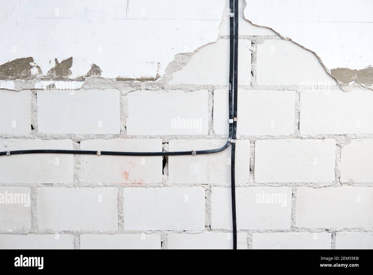 Electrical wires on a brick wall. Cable laying Stock Photo Alamy