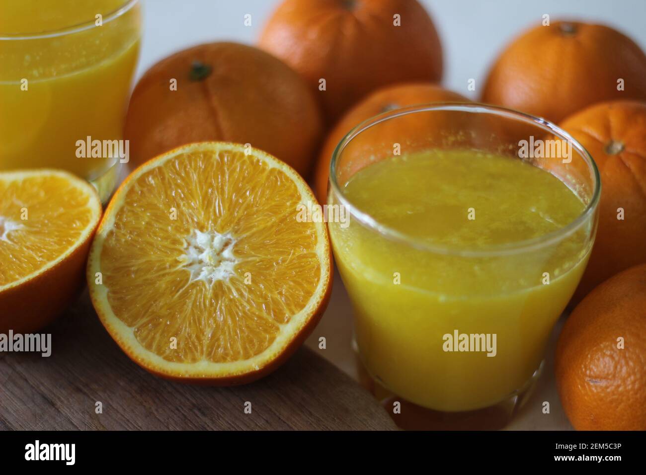 Glass of Kinnow Juice. It is juicier than orange and has more sour taste. The Kinnow is a high yield mandarin hybrid orange like fruit cultivated exte Stock Photo