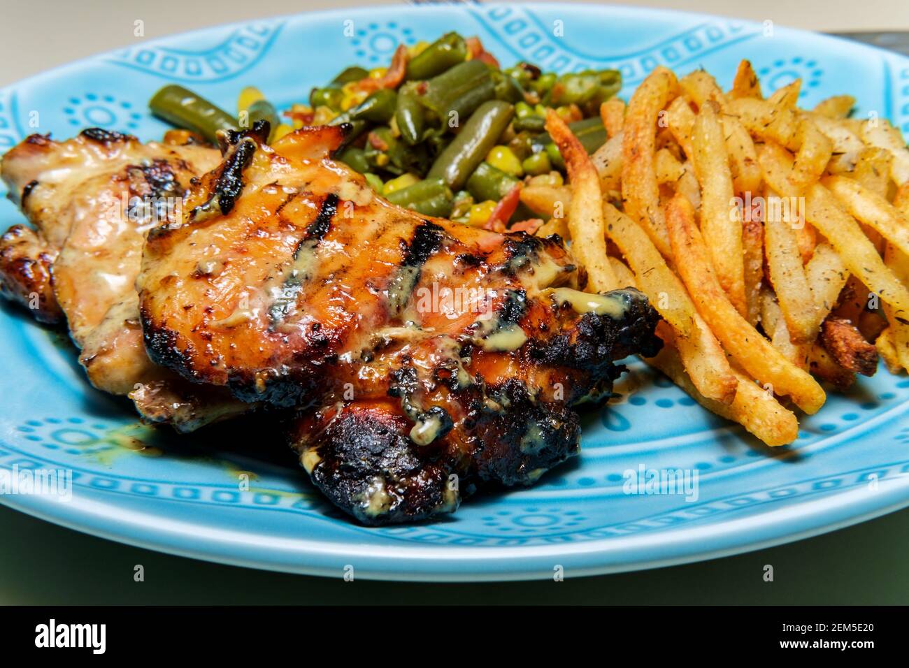 Honey mustard grilled chicken thigh dinner served with homemade