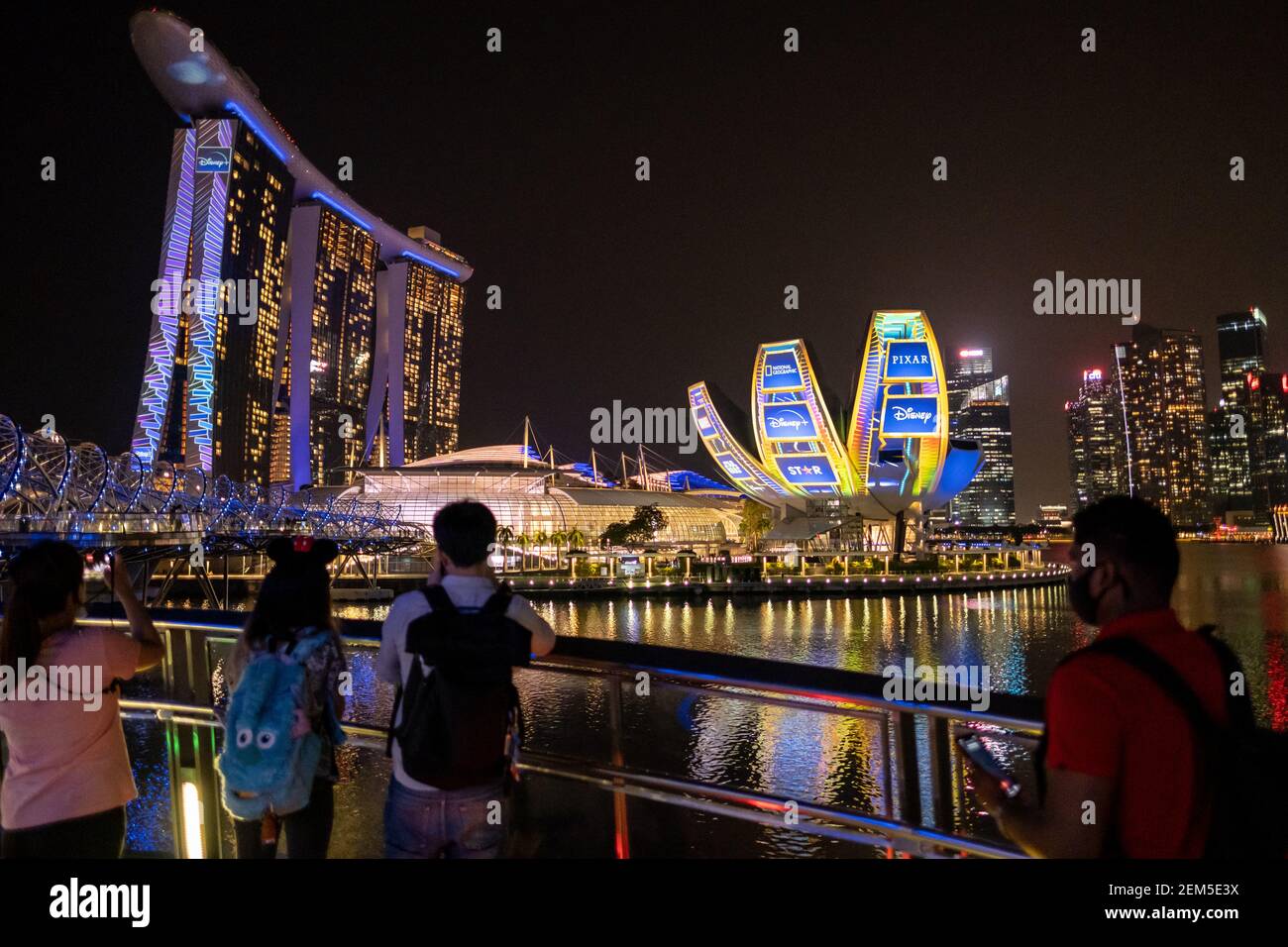 People Are Seen Watching Disney Showcase That Was Projected At The Singapore Art Science Museum And The Marina Bay Sands Singapore Disney Was Launched In Singapore On The 24th February 21 Making The
