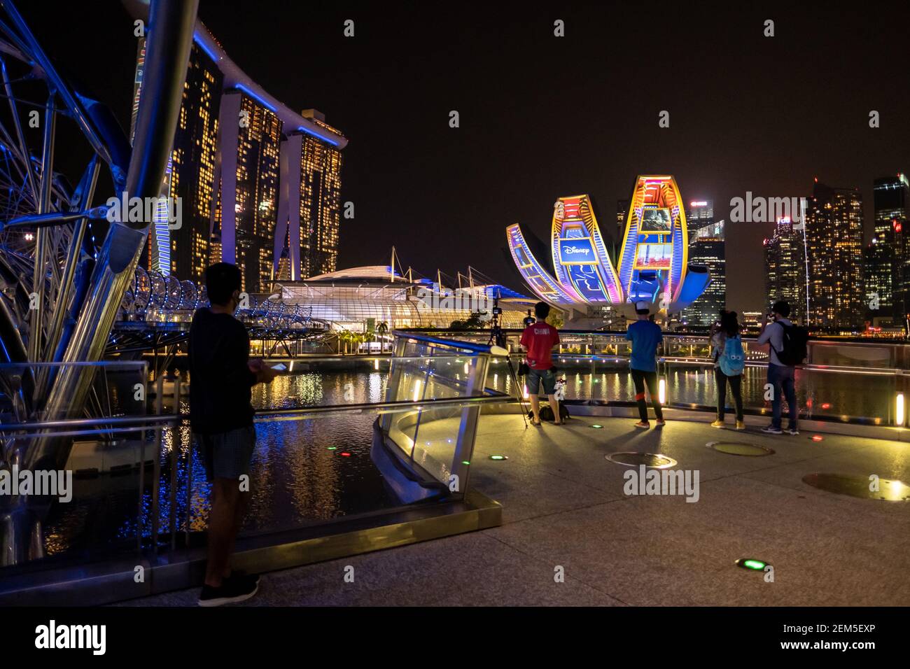 People Are Seen Watching Disney Showcase That Was Projected At The Singapore Art Science Museum And The Marina Bay Sands Singapore Disney Was Launched In Singapore On The 24th February 21 Making The Country The First In The World To Receive