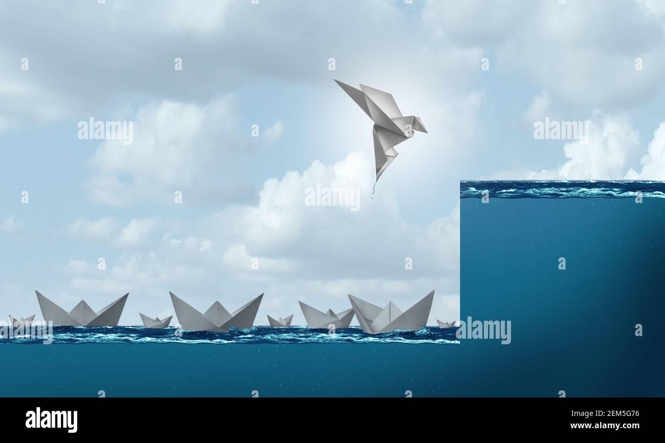 Change and success as a business leadership and leader concept as a paper boat rising as a bird in flight to a higher level as corporate progress. Stock Photo