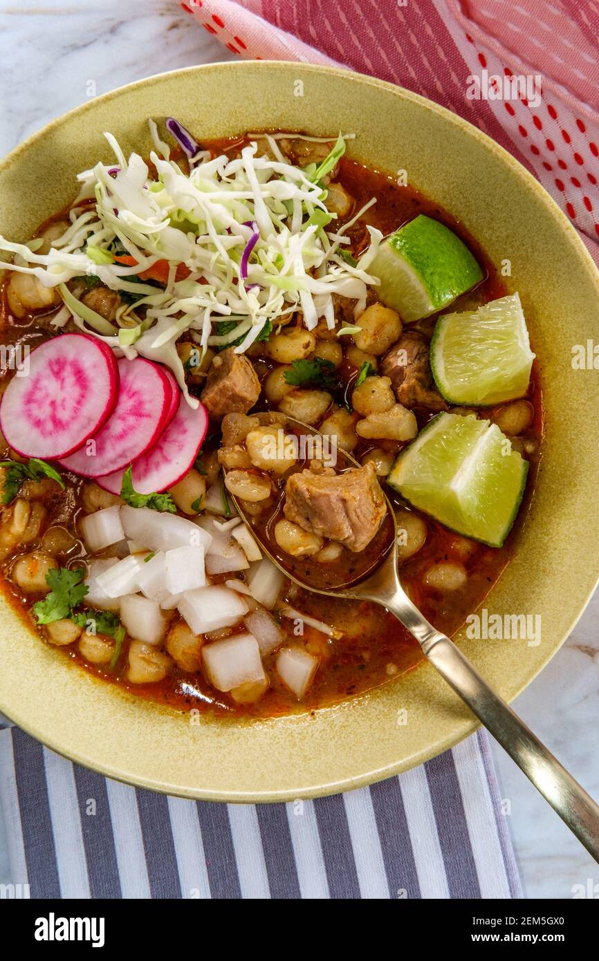 Mexican Pozole rojo pork and hominy stew with variety of fresh ...