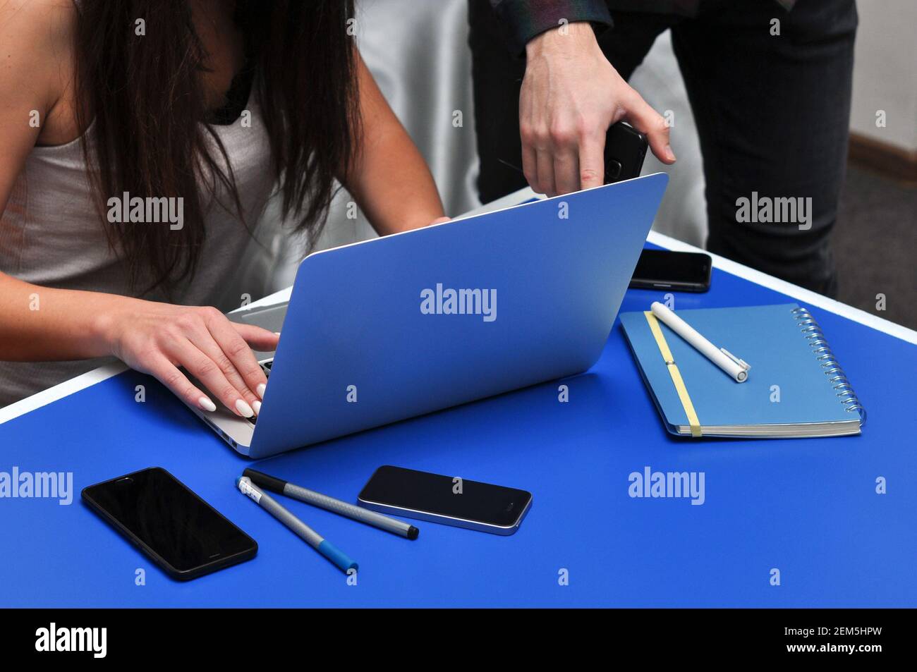 Programmer, Mobile Application Designers, Web Designer working at office. Teamwork and programming websites and mobile applications on the laptop. Stock Photo