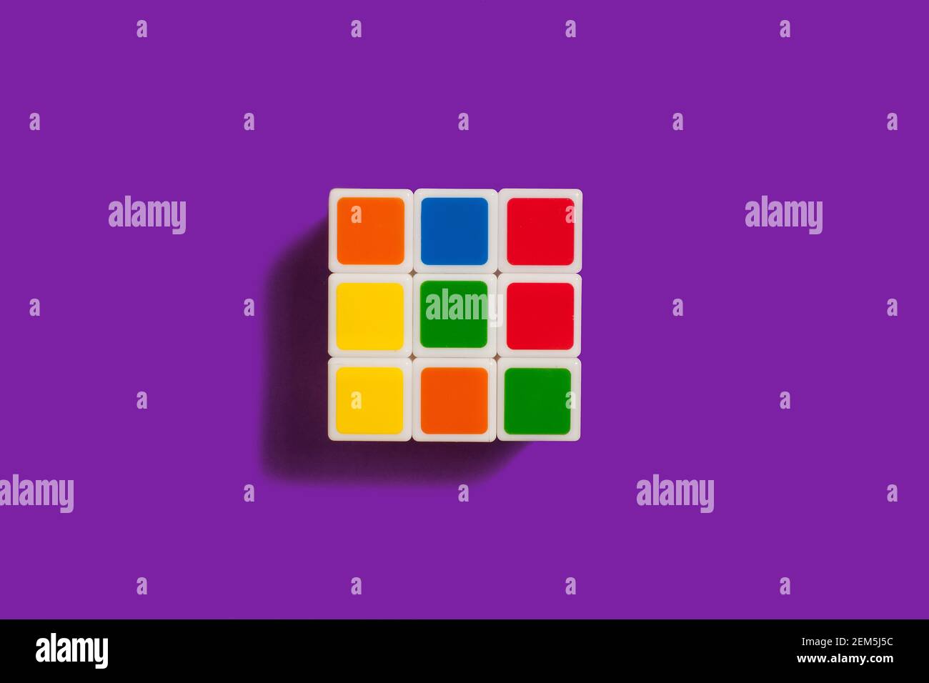 Rubiks Cube on a purple background Stock Photo