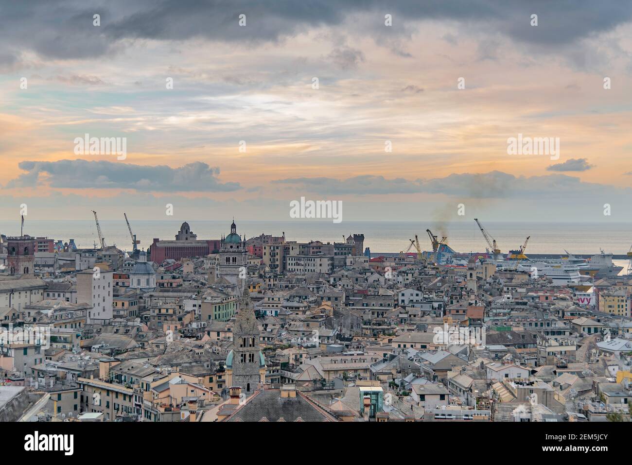 The city of Genoa with its port seen from above, towards sunset Stock Photo