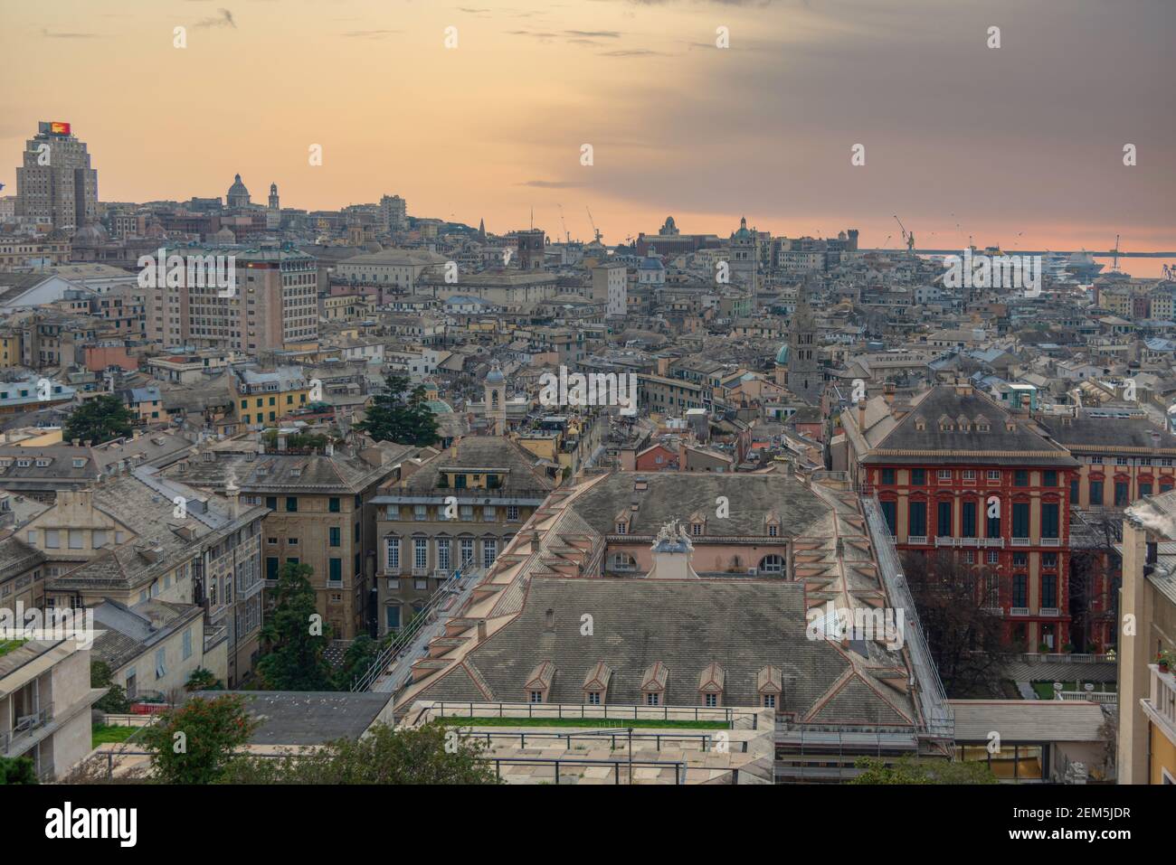 The city of Genoa with its port seen from above, towards sunset Stock Photo