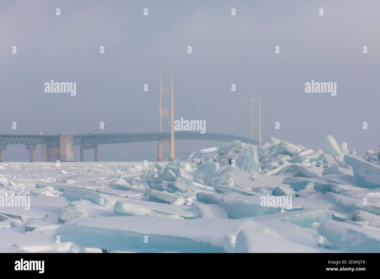 Blocks of blue ice in front of the Mackinac Bridge Stock Photo