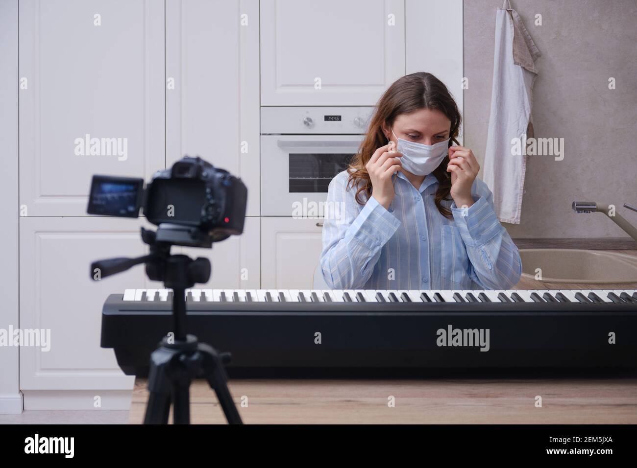 Online piano lessons and video recording of playing a musical instrument in  isolation during the coronavirus quarantine Stock Photo - Alamy