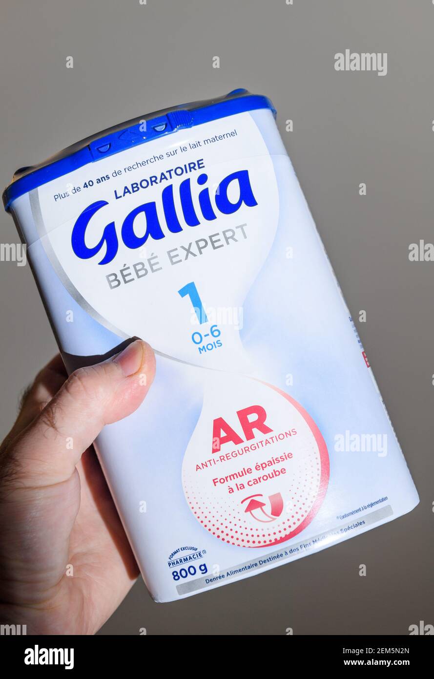 Paris, France - Feb 7, 2021: POV male hand holding looking at the Gallia  Bebe Expert AR dried milk formula for infants Stock Photo - Alamy