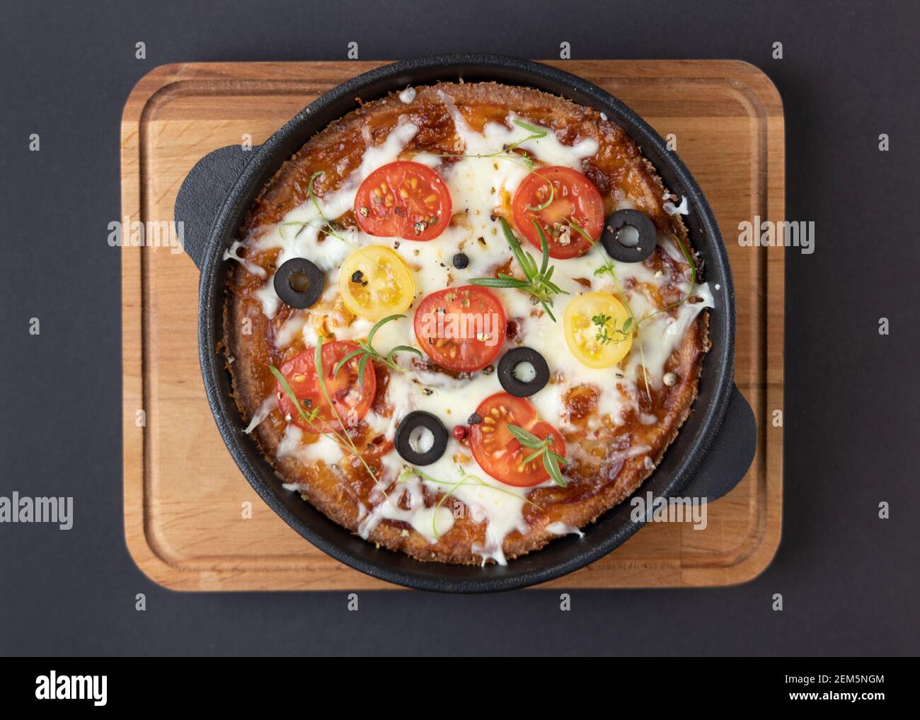 Low-carb keto diet Pizza with mozzarella and tomato crust with cheese filling. Low carb keto diet cake made from almond flour and mozzarella instead Stock Photo