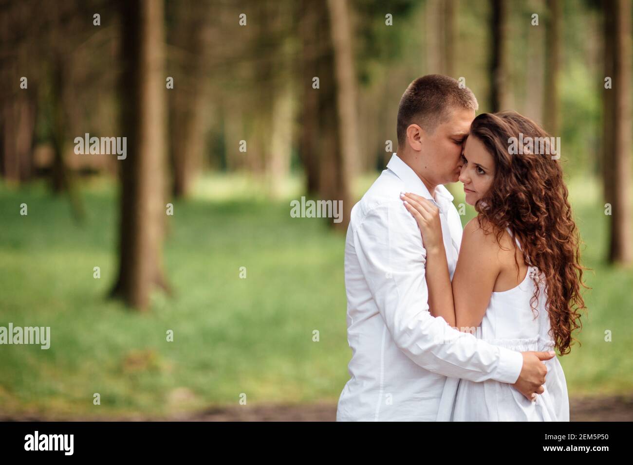 Teenage couple hugging in park hi-res stock photography and images - Alamy