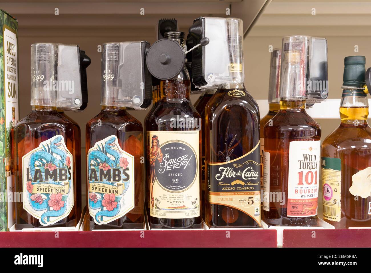 6 bottles of ultra premium rum Lamb's and  sailor jerryin a row for sale Stock Photo