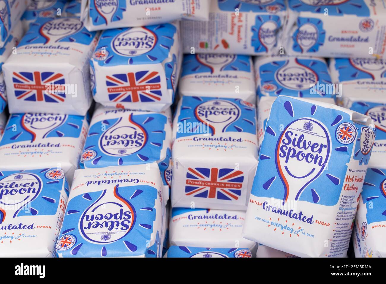 a lot of packets of british caster sugar by silver spoon Stock Photo