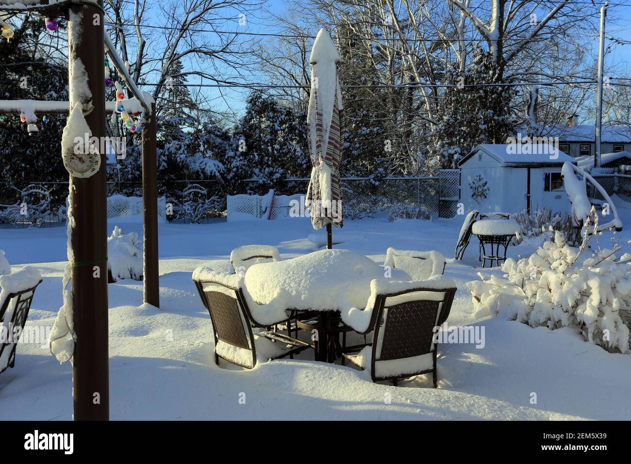 Snow covered backyard patio Long Island New York Stock Photo Alamy