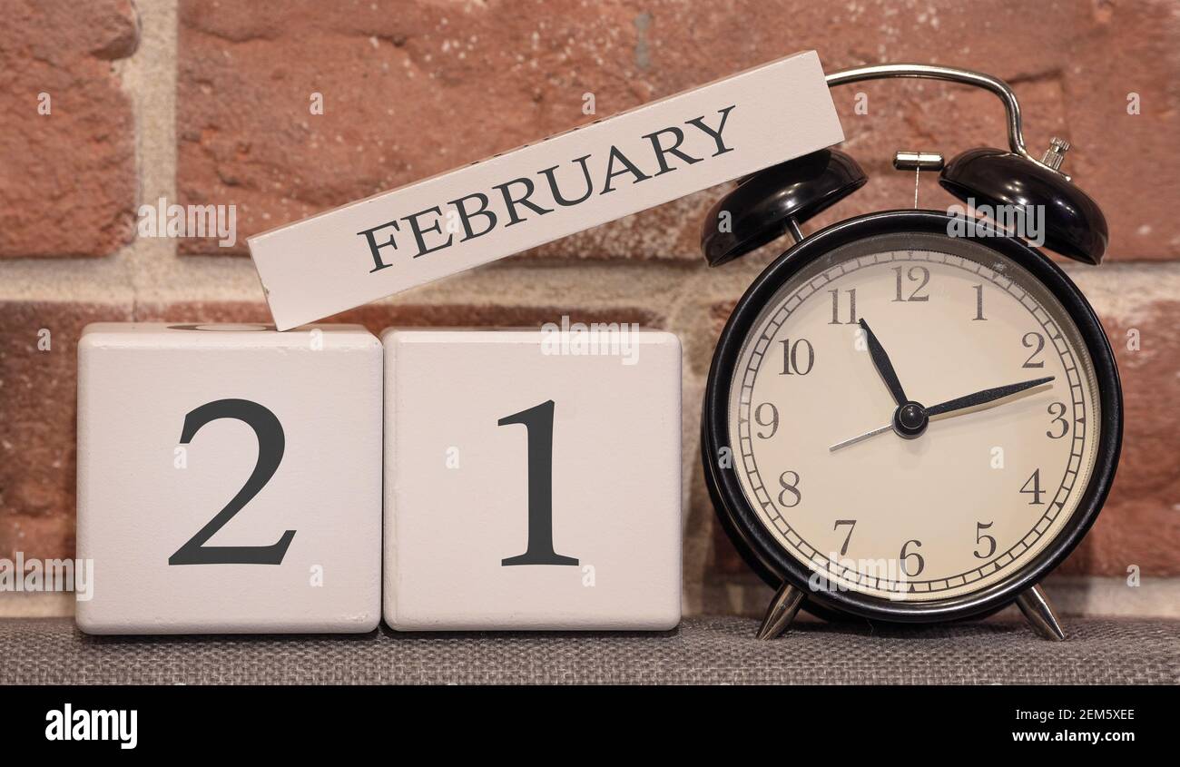 February 21 Checkiday Important date, February 21, winter season. Calendar made of wood on a ...