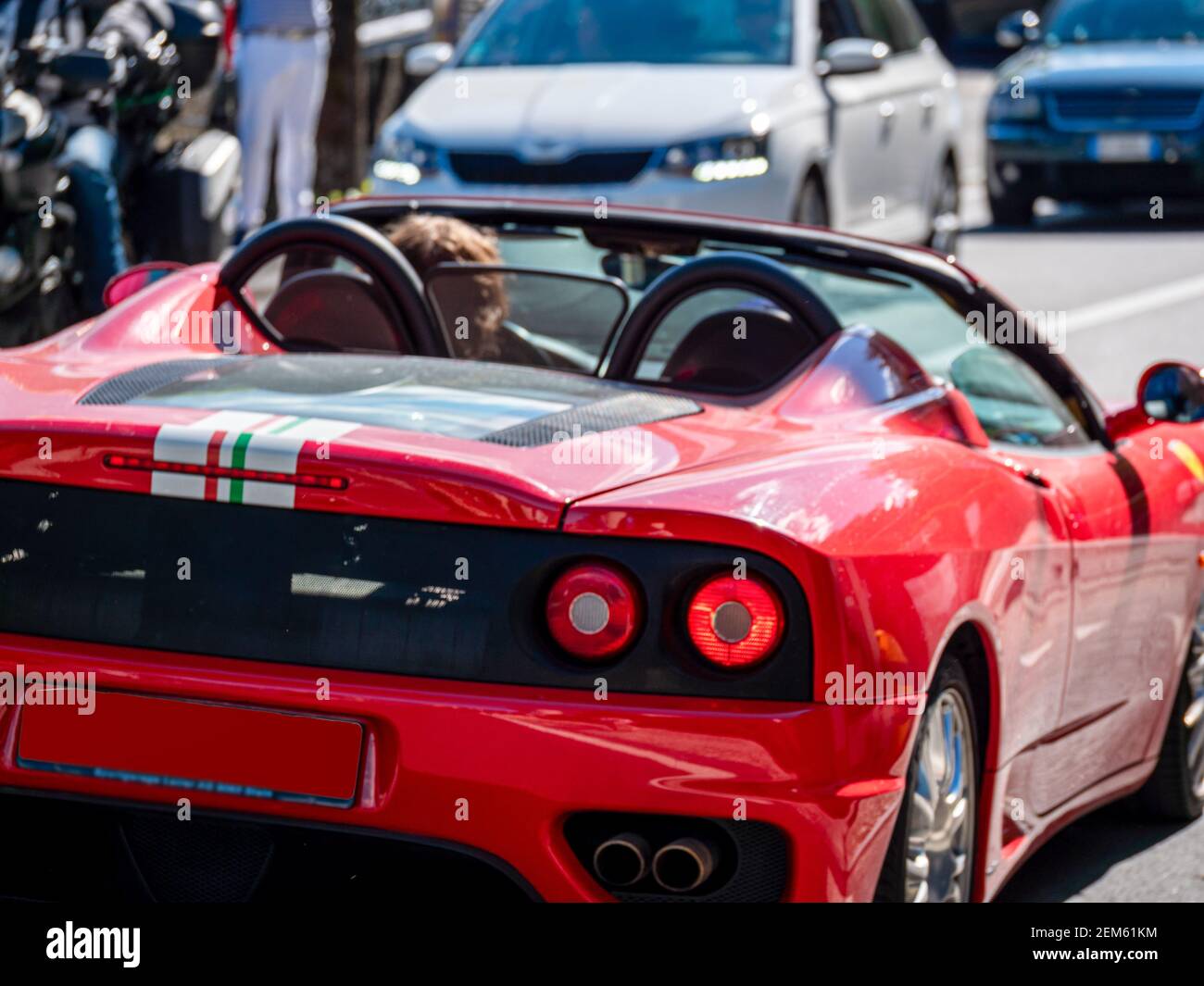 Red sports car in street traffic. Vintage style Stock Photo