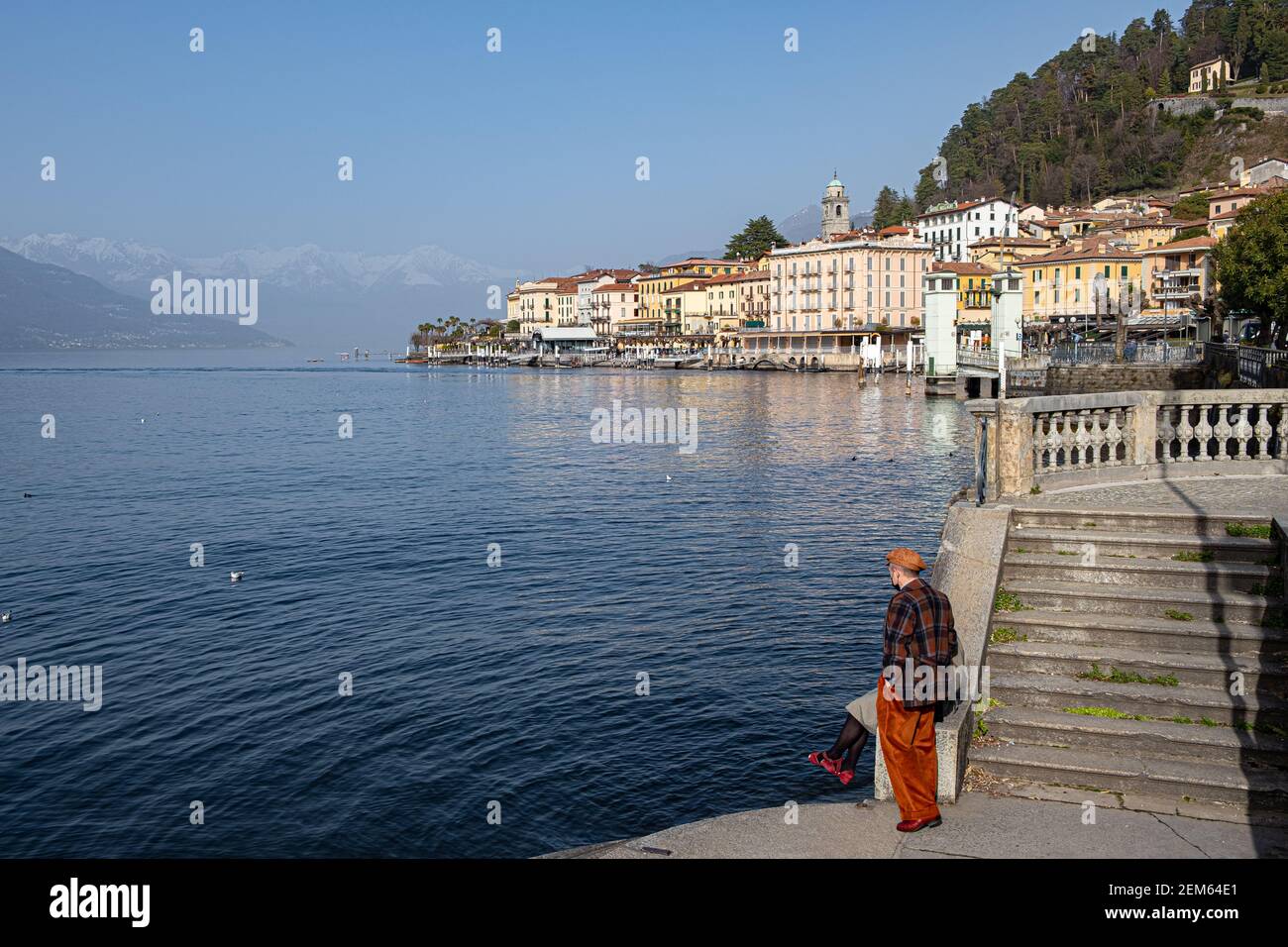 The shores of Lake Como with the village of Varenna with the snow