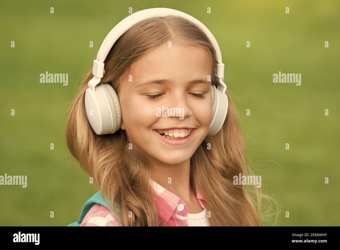 Listen music while walking. Girl headphones listening music
