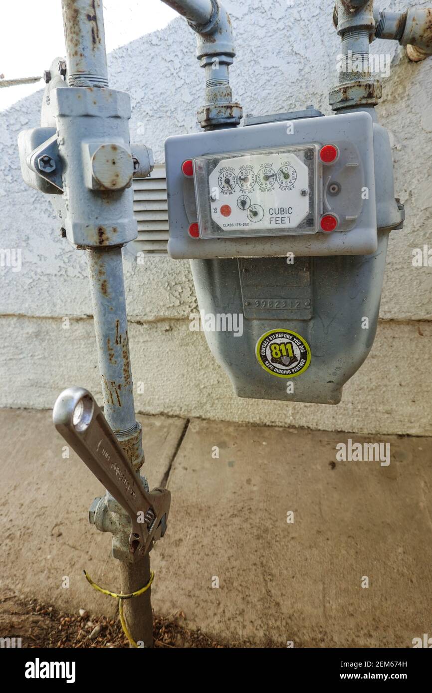 Residential home gas meter with wrench USA Stock Photo