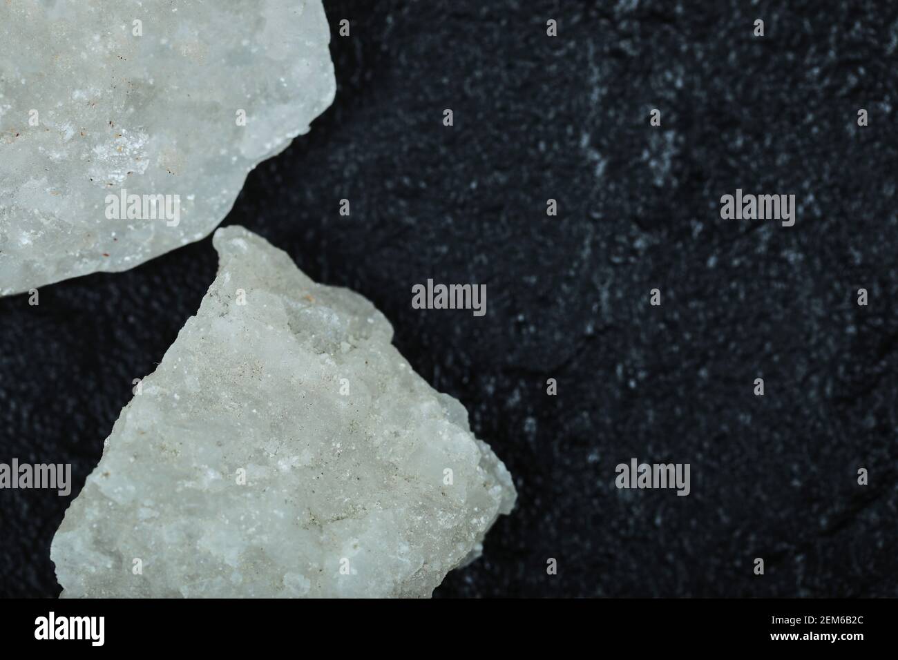 Crystalized salt rocks on dark background. Close up Stock Photo