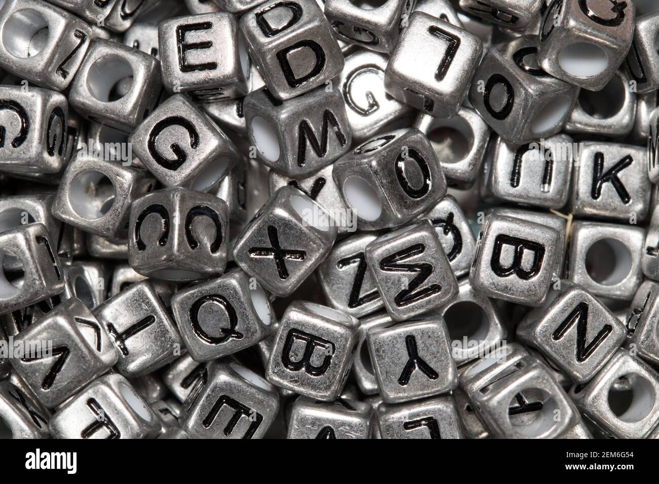 Close up of alphabetic letters in silver metallic beads Stock Photo