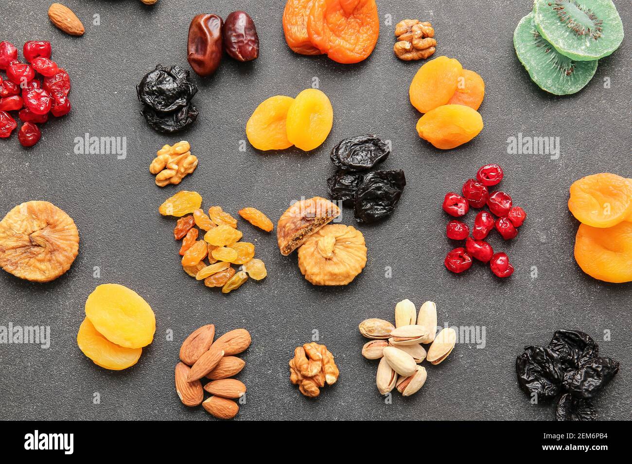 Different dried fruits and nuts on dark background Stock Photo Alamy