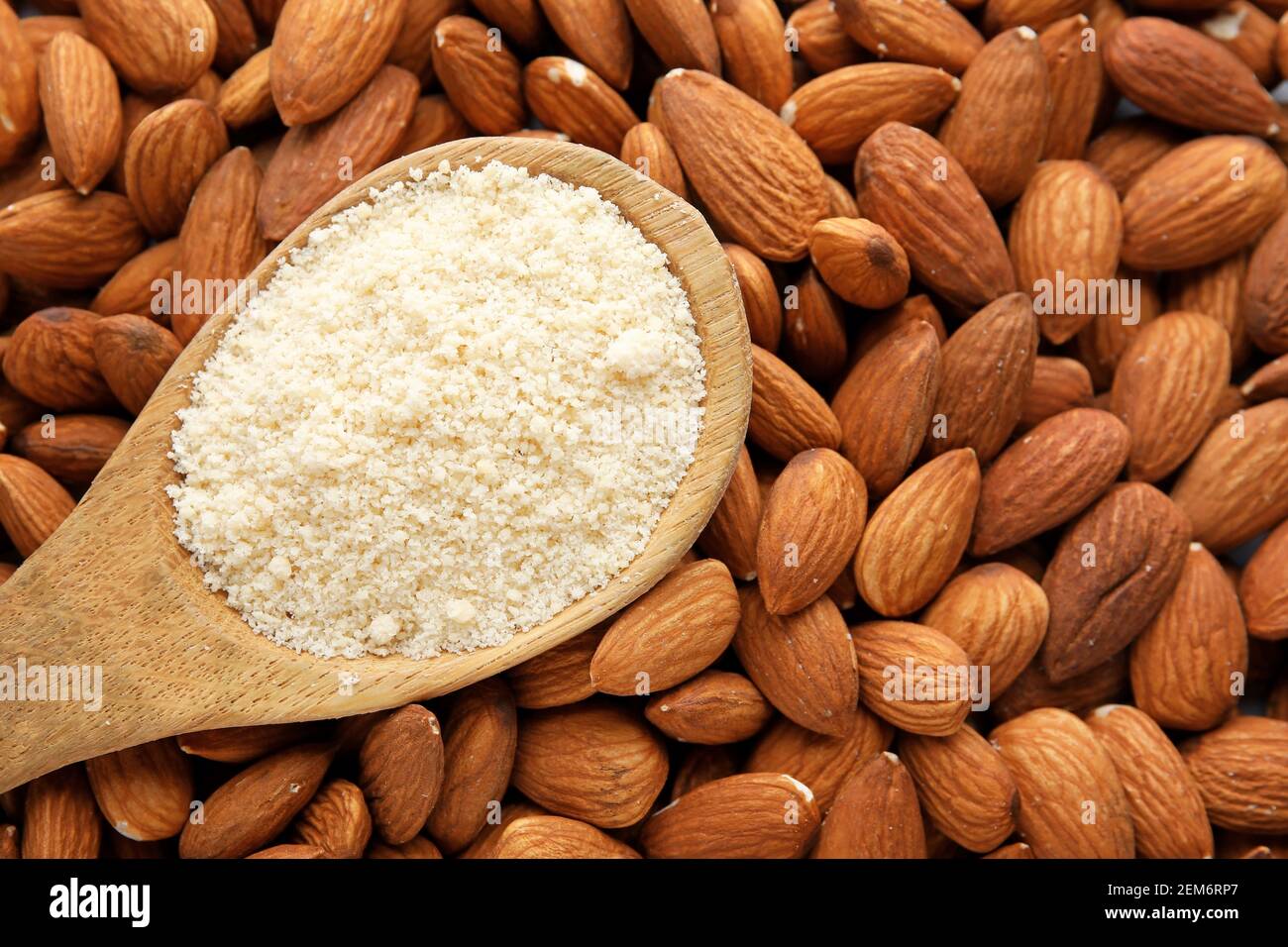 Spoon with almond flour and nuts, closeup Stock Photo Alamy