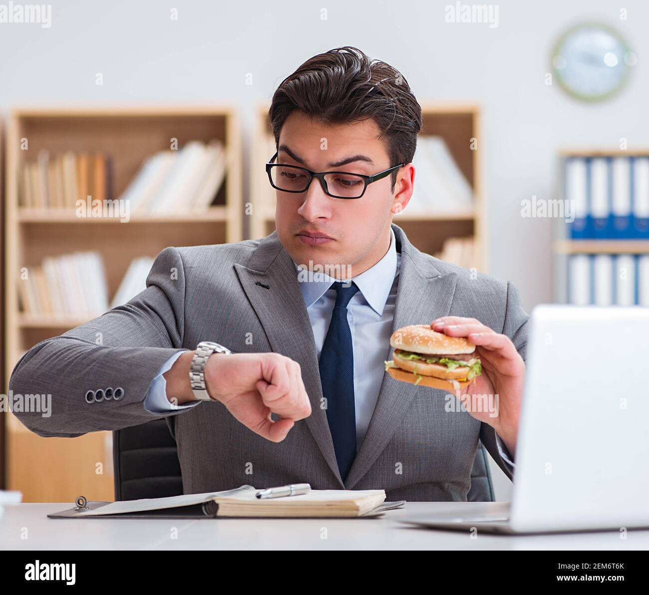The Hungry Funny Businessman Eating Junk Food Sandwich Stock Photo Alamy the-hungry-funny-businessman-eating-junk-food-sandwich-stock-photo-alamy