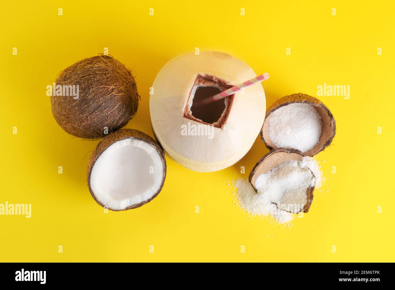 Fresh and ripe coconuts on color background Stock Photo