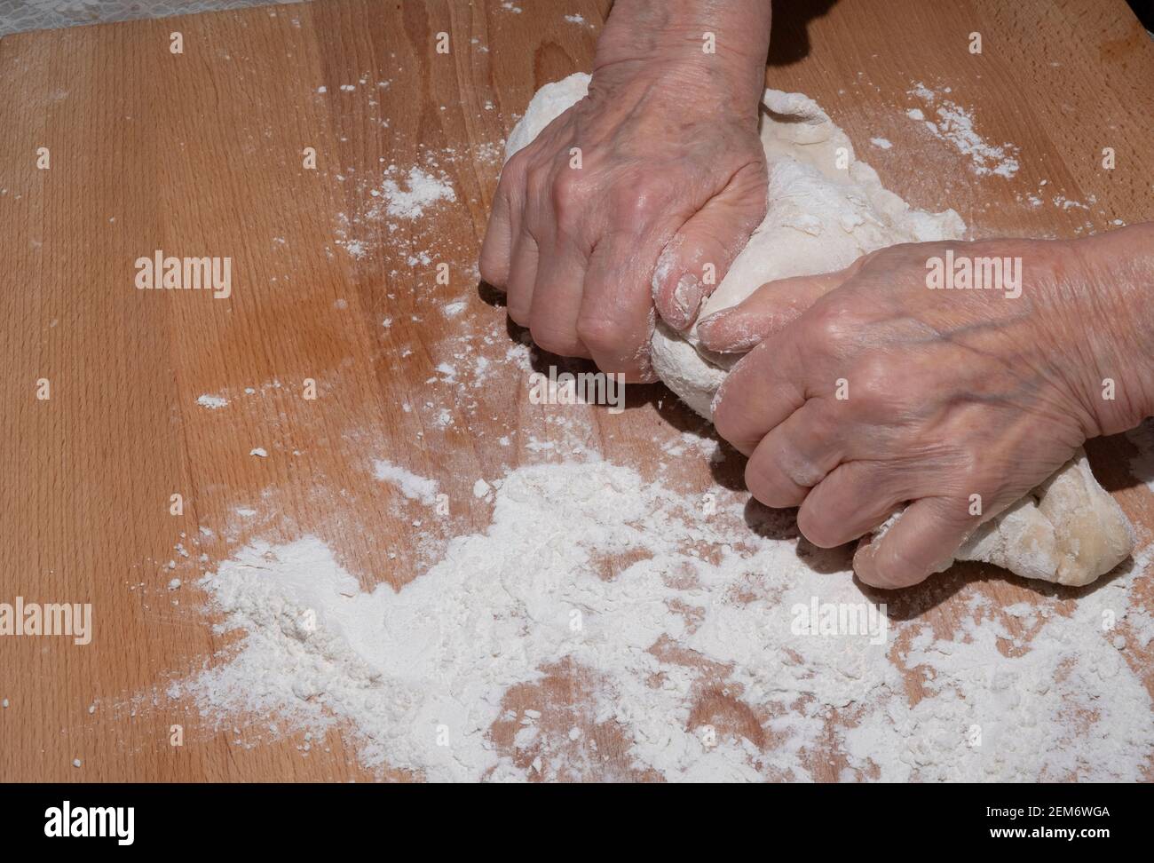Old woman's hands kneading dough Stock Photo - Alamy
