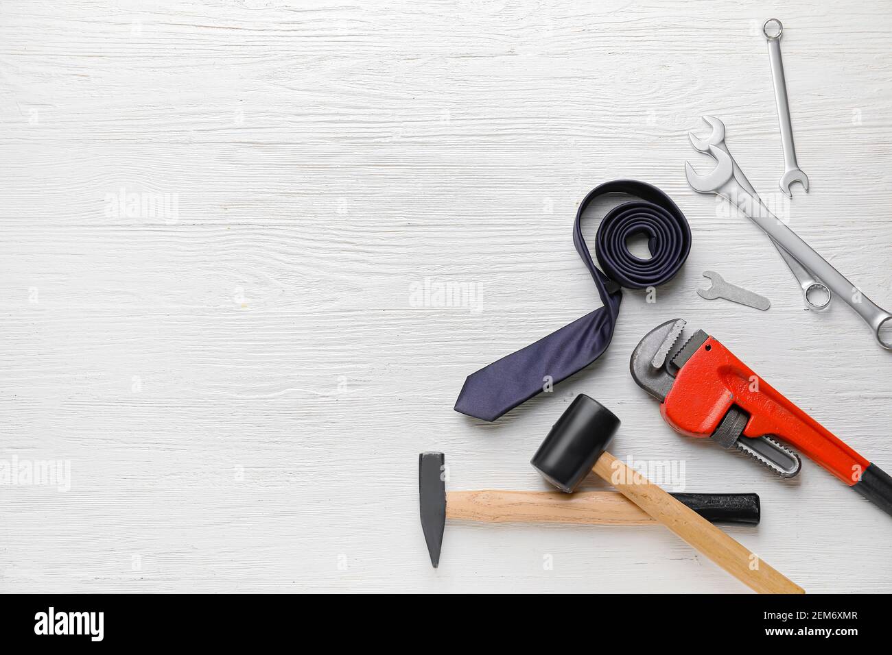 Set of tools on white wooden background Stock Photo - Alamy