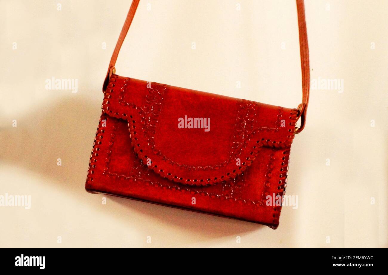 close up view of indian woman fashionable handmade leather bag or purse in shop display 2EM6YWC