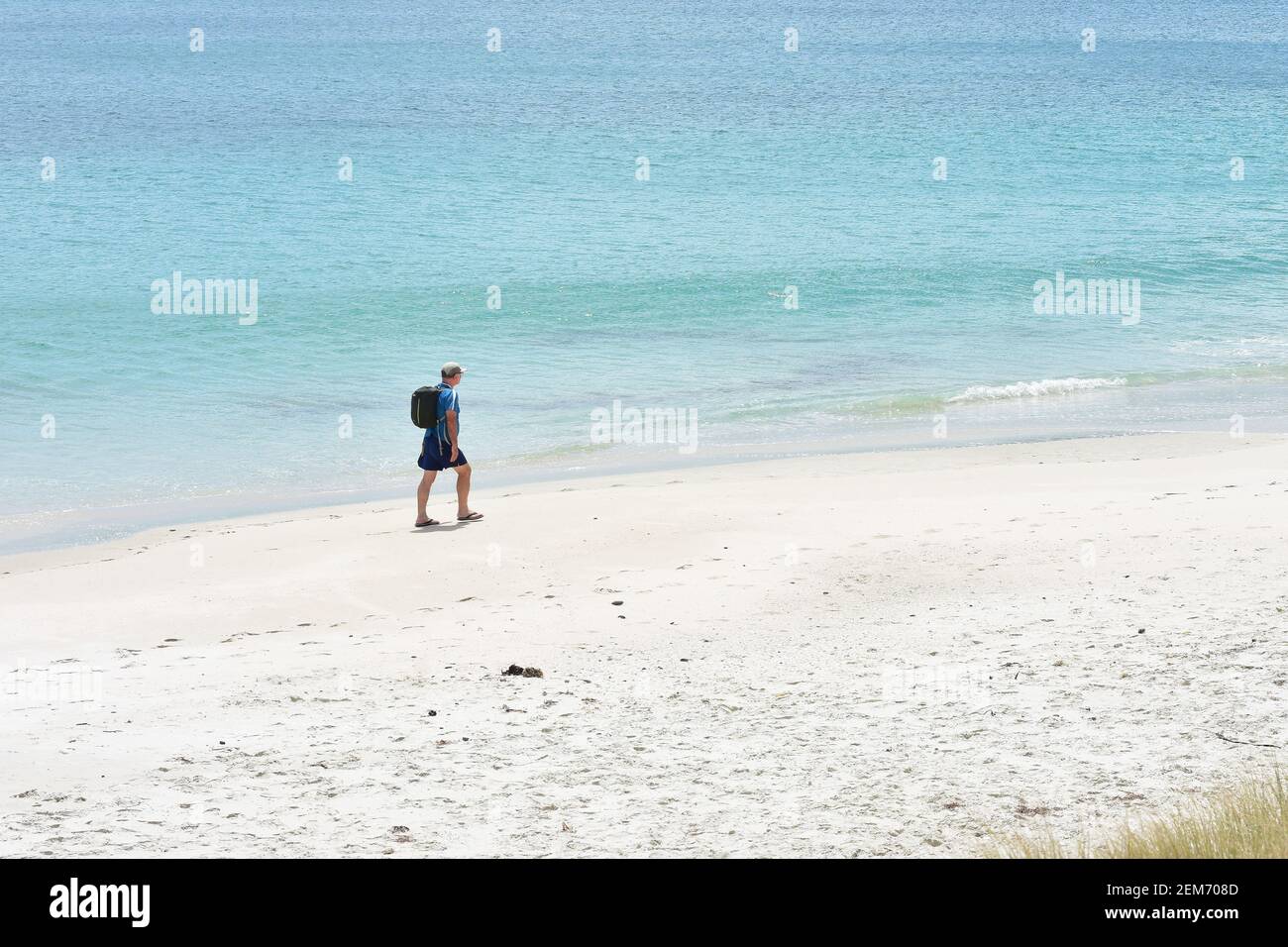 Empty sandy beach man walking hi-res stock photography and images - Alamy