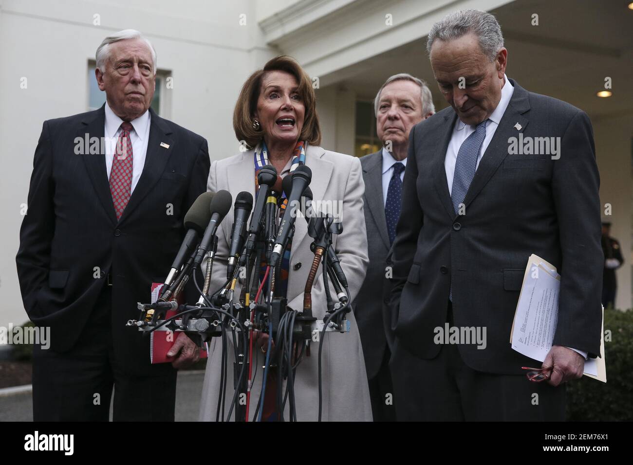 House Democratic leader Rep. Nancy Pelosi, D-CA, talks to reporters outside of the West Wing of the White House on following a border security briefing with President Donald Trump and congressional leadership at the White House on January 2, 2018 in Washington, DC. Next to Pelosi Sen. Chuck Schumer, D-N.Y., right, Rep. Steny Hoyer, left, D-Md., left, and Sen. Dick Durbin, D-Ill, second right. (Photo by Oliver Contreras/SIPA USA) Stock Photo