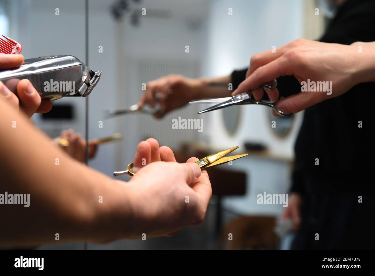 Munich, Germany. 21st Feb, 2021. Haircutting scissors are on display at