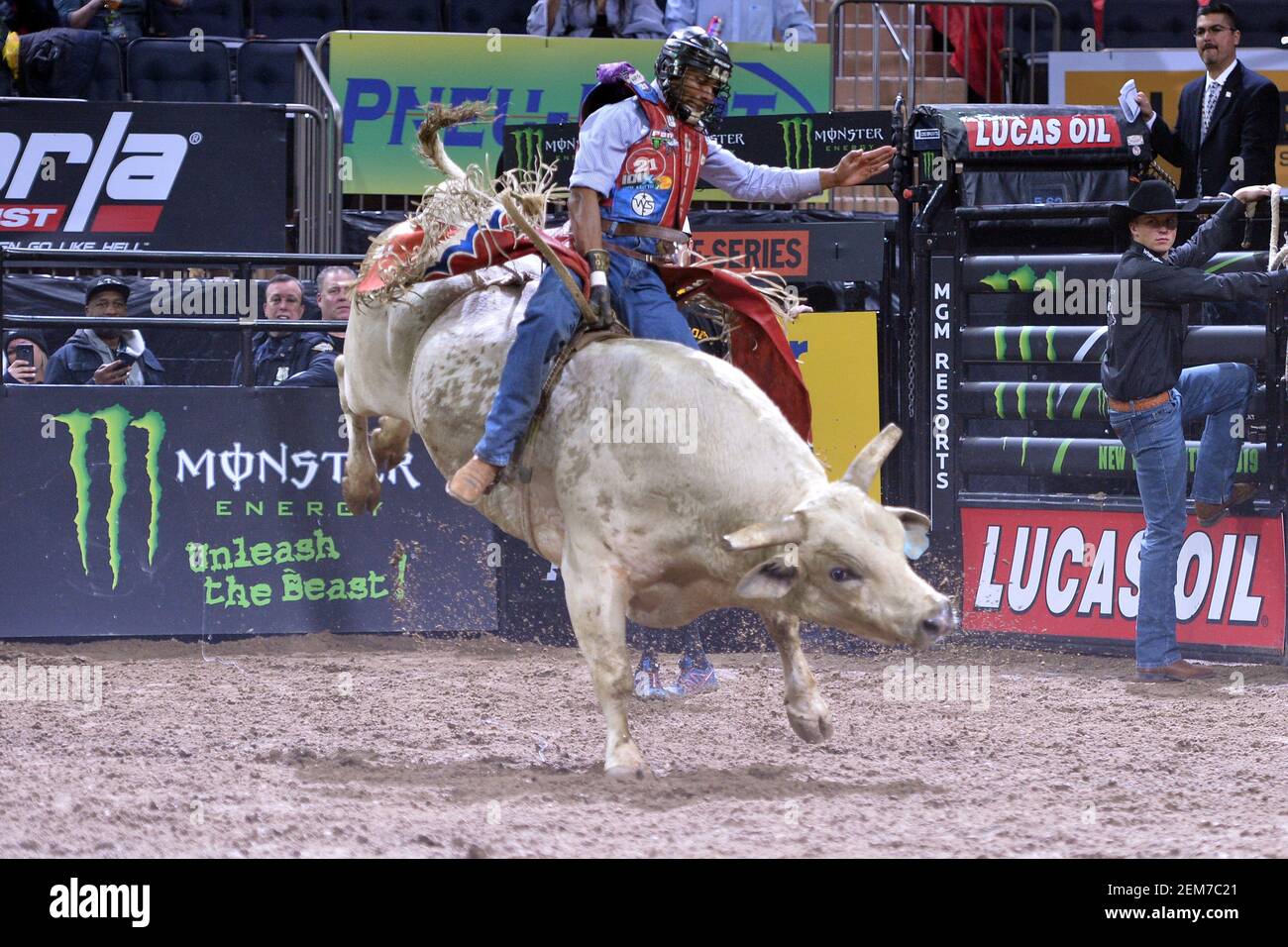 Professional bull rider Alisson de Souza from Brazil rides a bull named ...