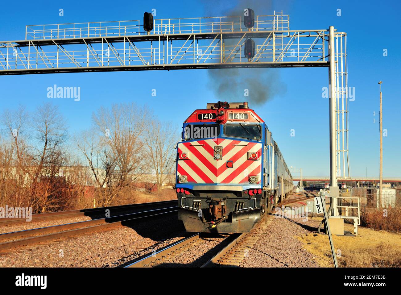 Elburn, Illinois, USA. A Metra commuter train passing through a signal ...