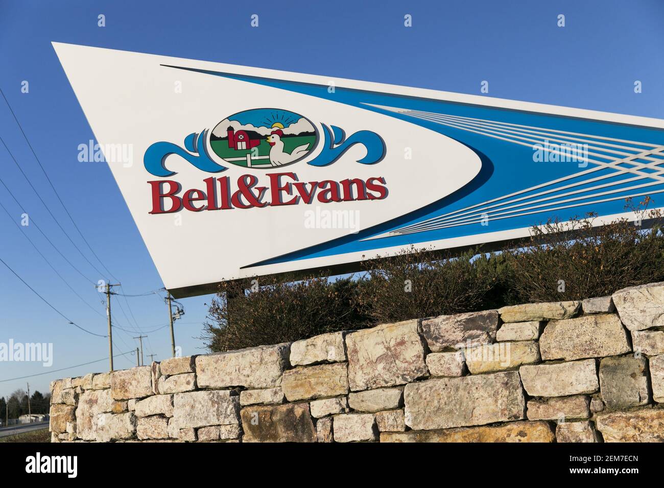 A logo sign outside of a facility occupied by Bell & Evans in ...