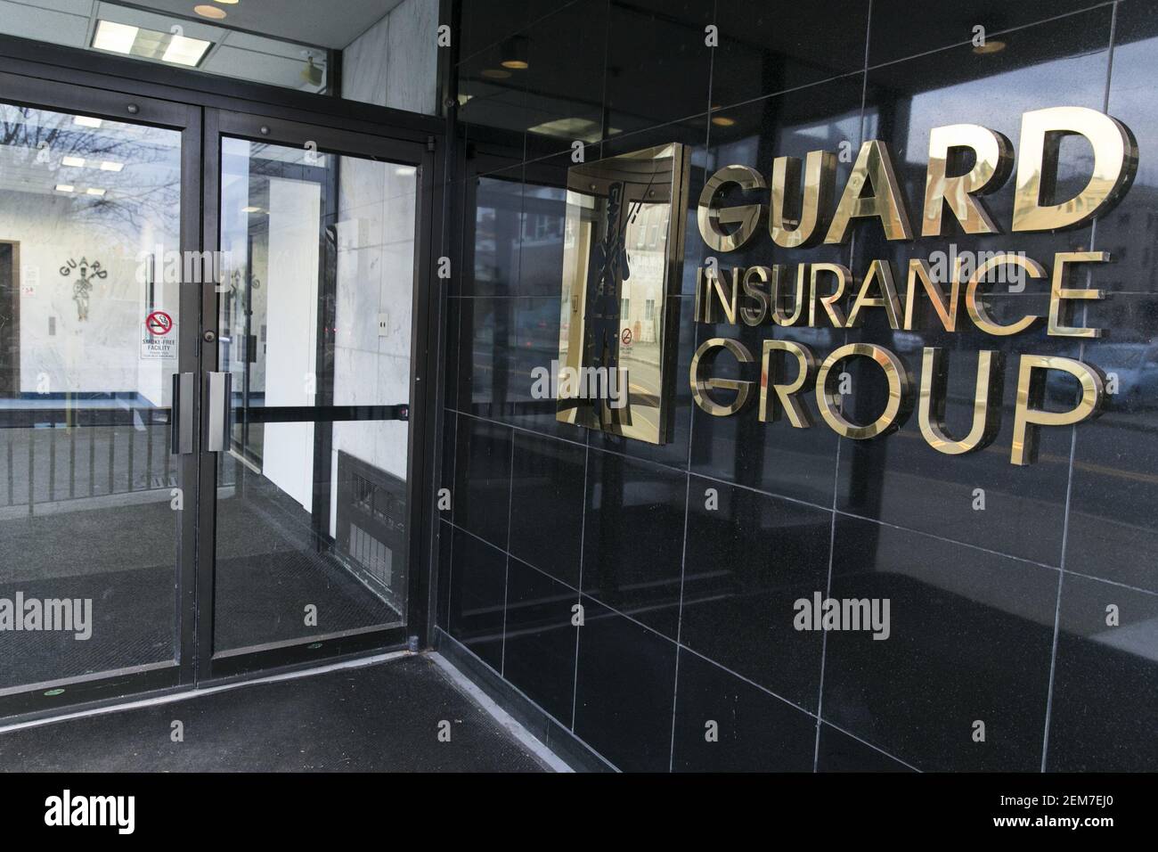 A logo sign outside of the headquarters of the GUARD Insurance Group in