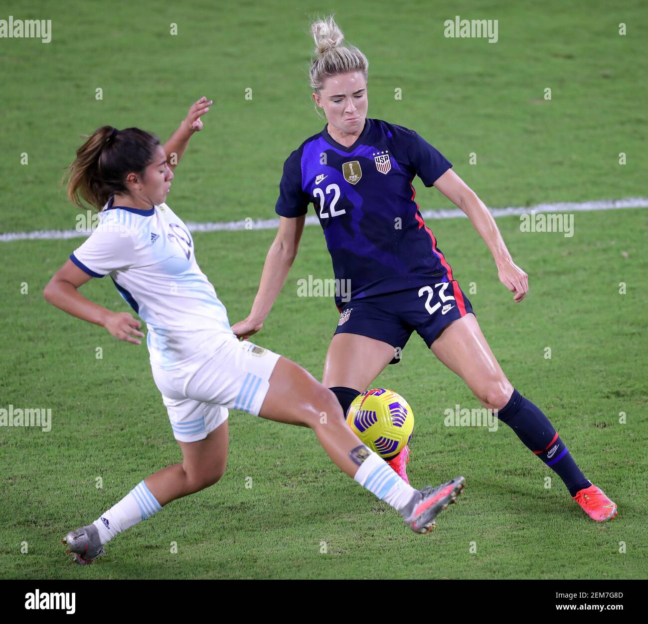 Orlando, Florida, USA. February 24, 2021: United States midfielder KRISTIE MEWIS (22) competes for the ball against Argentina midfielder DAIANA FALFAN (20) during the SheBelieves Cup USA vs Argentina match at Exploria Stadium in Orlando, Fl on February 24, 2021. Credit: Cory Knowlton/ZUMA Wire/Alamy Live News Stock Photo