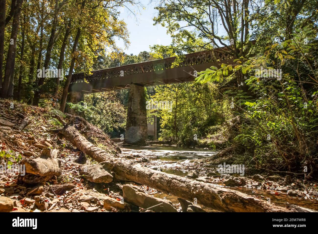 Cullman, Alabama/USA-Oct. 17, 2020: Long exposure shot of Crooked Creek with the Clarkson Covered Bridge in the background and sun spots visible. Stock Photo