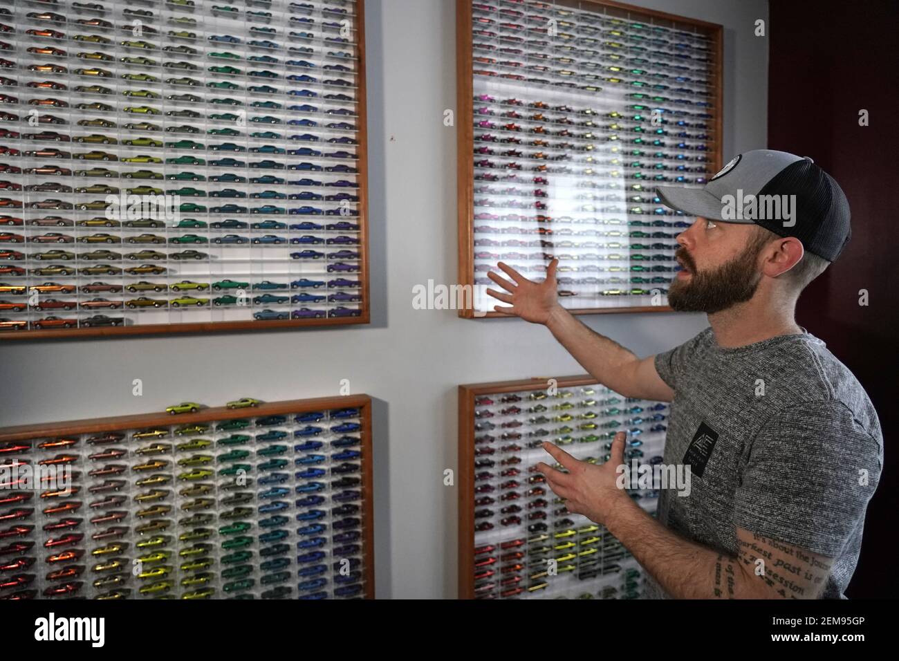 Avid Hot Wheels collector Ryan Wurzbacher has a full set of 1968 cars  framed on a wall in a bedroom of his home in Andover. Ryan has a collection  of about 2,500