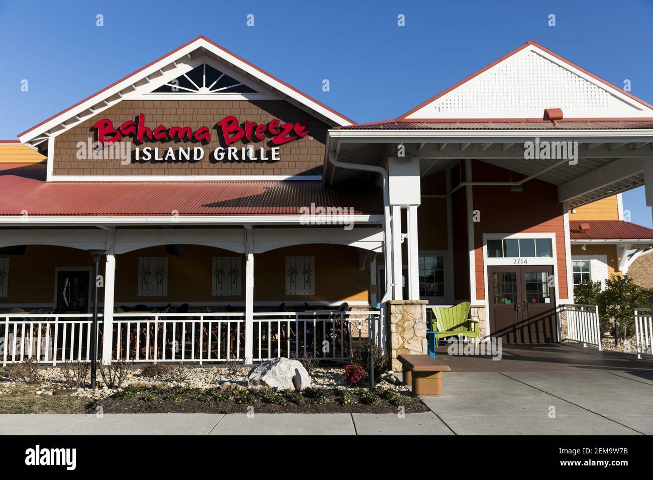 A logo sign outside of a Bahama Breeze restaurant location in