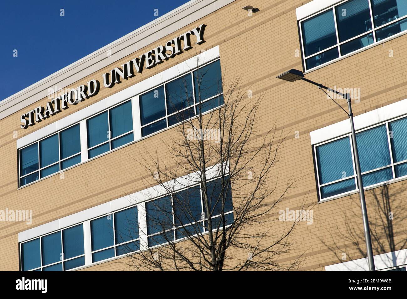 A logo sign outside of a facility occupied by Stratford University in