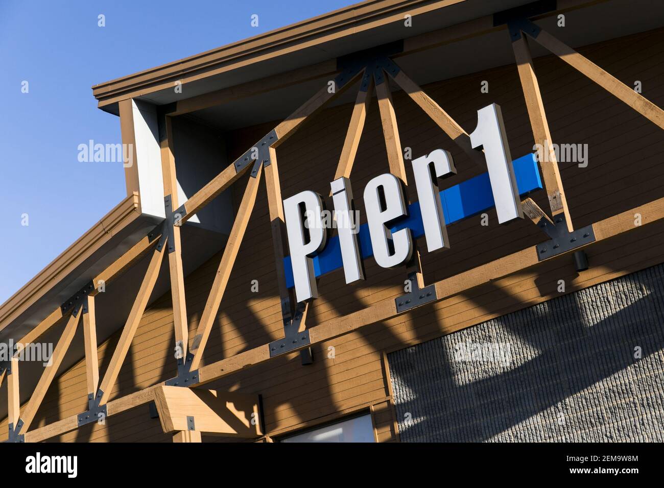 A logo sign outside of a Pier 1 Imports Inc., retail store in