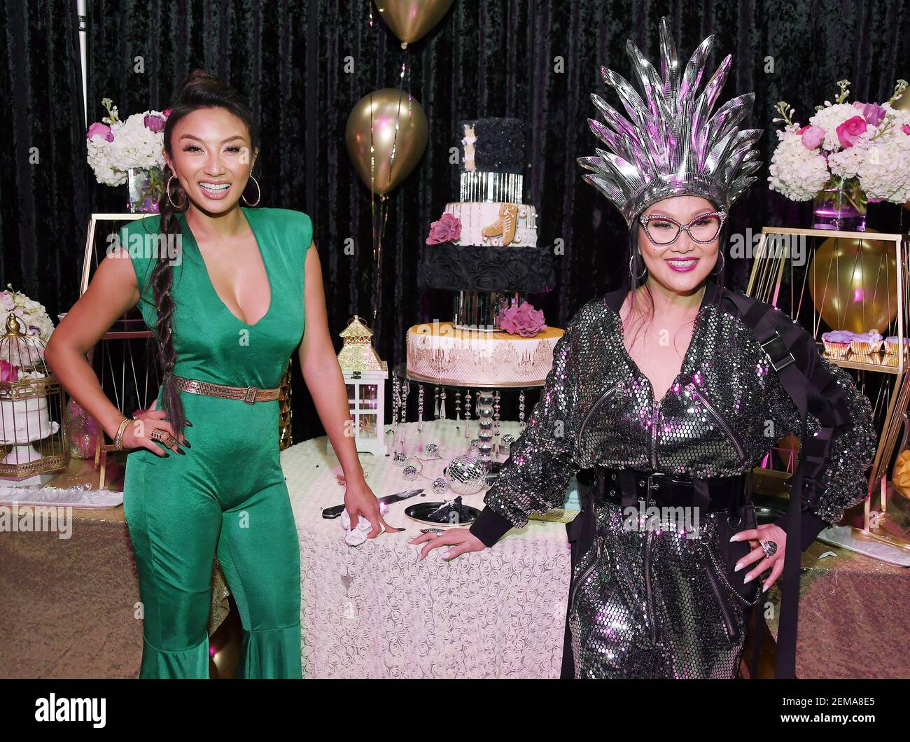 (L-R) Jeannie Mai and Mama Mai during the cutting of the birthday cake