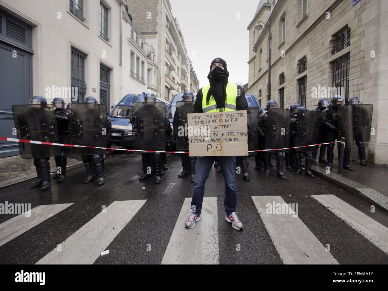 19 January 2019. Paris, France. Gilets Jaunes - Acte X take to the streets of Paris. A lone protester makes his feelings known to a wall of CRS riot police who have sealed a road along the route. An estimated 7,000 people took part in the looping 14 km route from Place des Invalides to protest tax hikes from the Government of Emmanuel Macron imposed on the people. An estimated 80,000 people took part in protests across the country. Regrettably the movement has attracted a violent element of agitators who often face off with riot police at the end of the marches which tends to deflect attentio Stock Photo